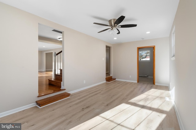 spare room featuring light hardwood / wood-style floors and ceiling fan