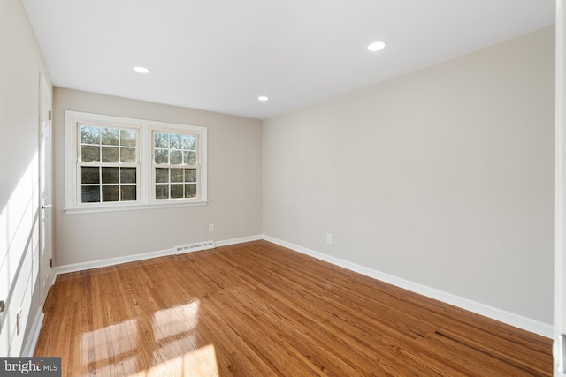 unfurnished room with light wood-type flooring