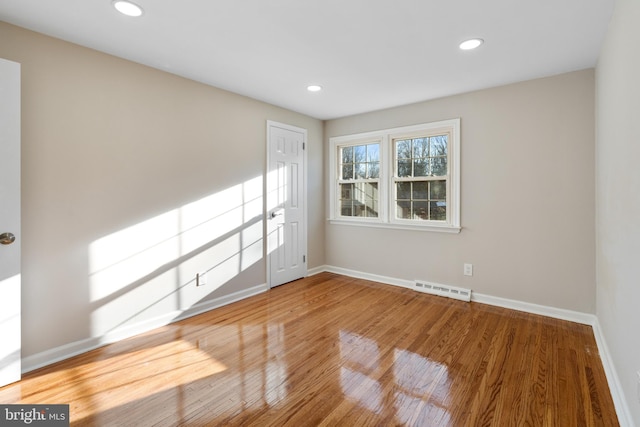 spare room featuring hardwood / wood-style floors