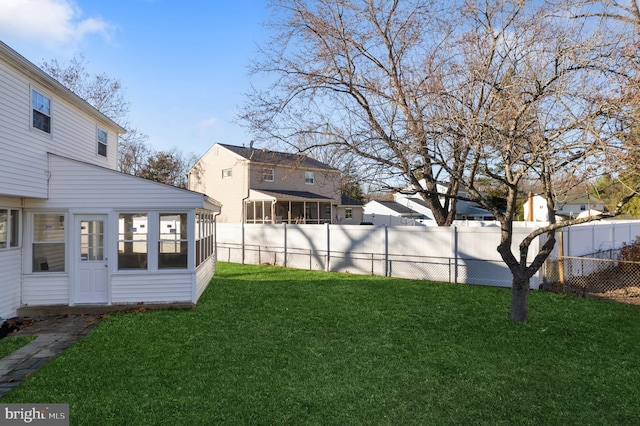 view of yard with a sunroom