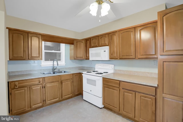 kitchen featuring white appliances, ceiling fan, and sink