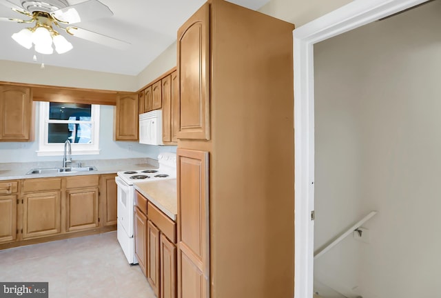 kitchen featuring ceiling fan, white appliances, and sink