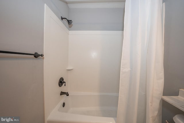 bathroom with shower / bath combination with curtain