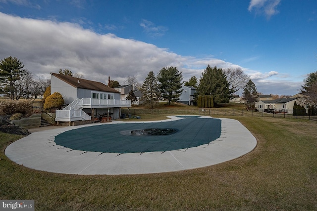 view of pool featuring a lawn and a patio