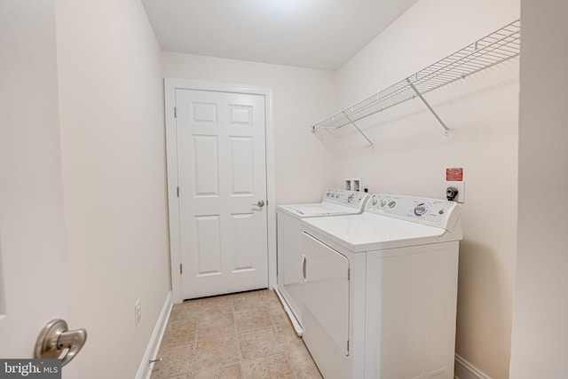 laundry room featuring washing machine and dryer