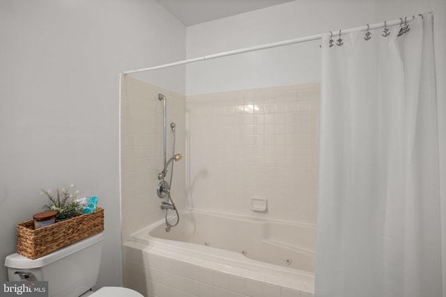 bathroom with shower / bath combo and toilet