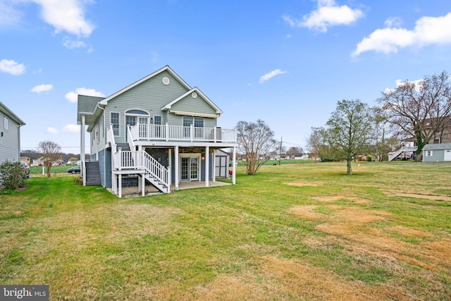 back of house with a yard and a wooden deck