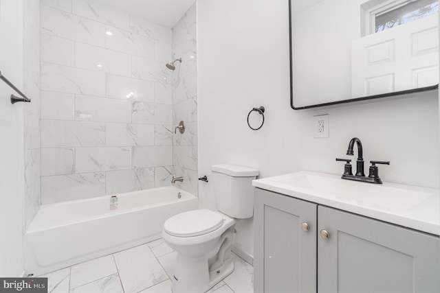 full bathroom featuring vanity, toilet, and tiled shower / bath