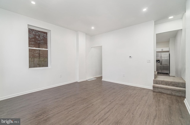 unfurnished room featuring dark hardwood / wood-style floors