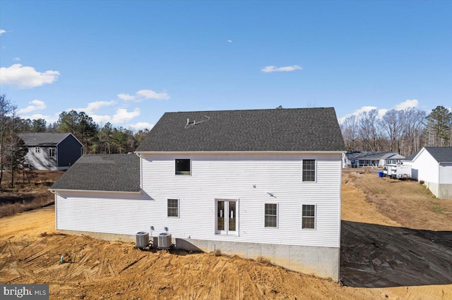 rear view of house featuring central AC unit