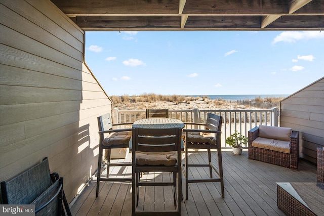 wooden deck featuring a water view