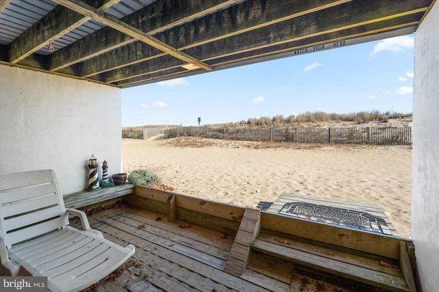 wooden deck with a rural view