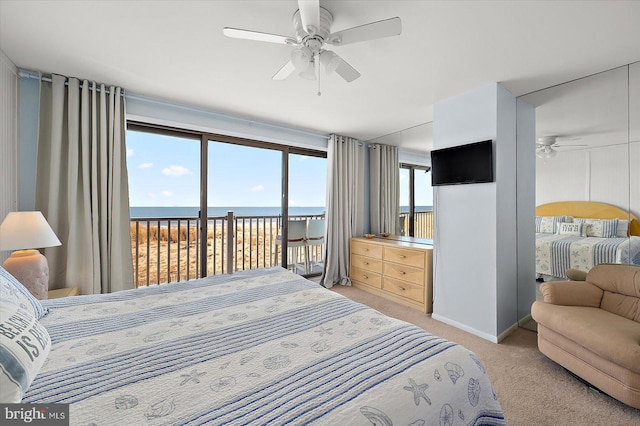 carpeted bedroom featuring access to exterior, multiple windows, and ceiling fan