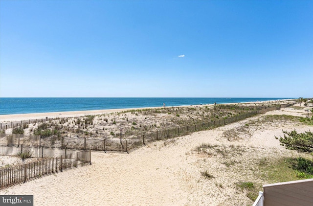 property view of water featuring a beach view