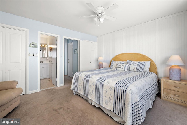 bedroom featuring carpet, ceiling fan, and connected bathroom