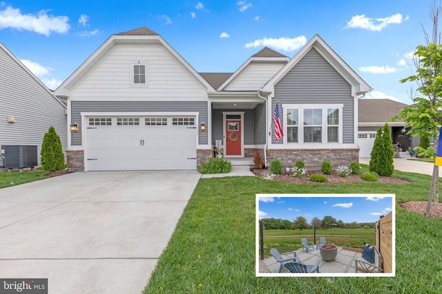 craftsman inspired home with central AC unit, a garage, and a front lawn