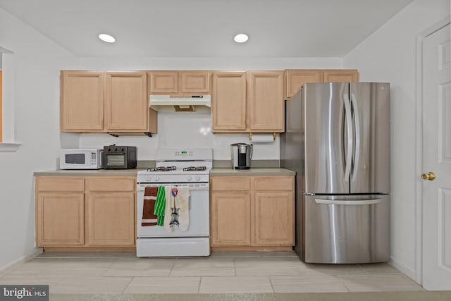 kitchen with light brown cabinets and white appliances