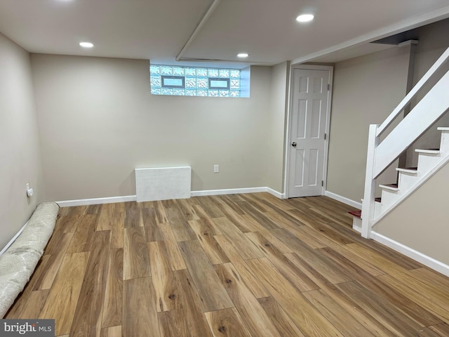 basement featuring hardwood / wood-style flooring