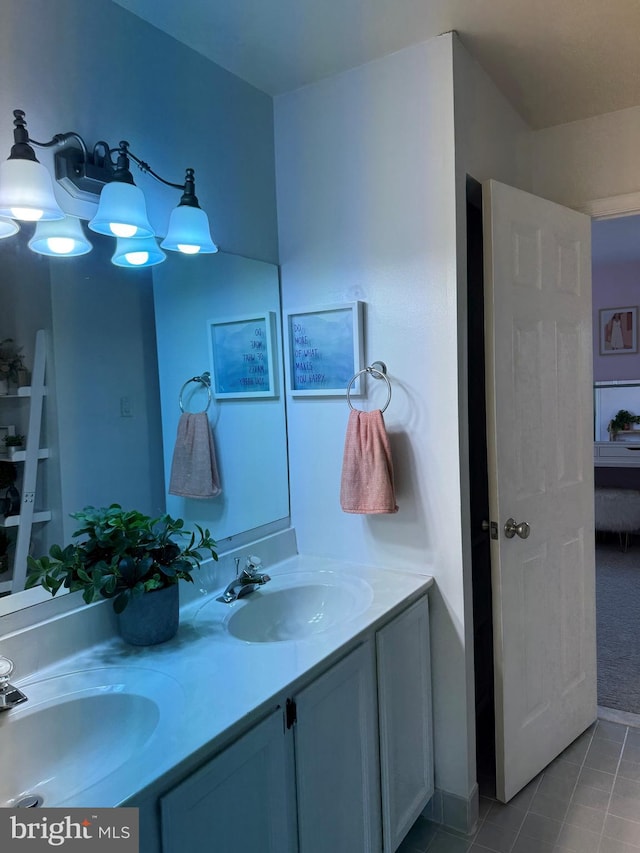 bathroom featuring tile patterned floors, vanity, and an inviting chandelier