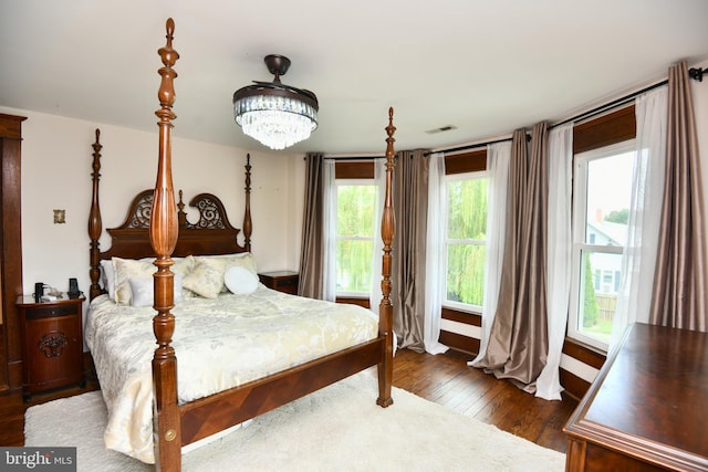 115 S Summit Ave, Woodstock, VA 22664 - bedroom with hardwood / wood-style flooring and a chandelier