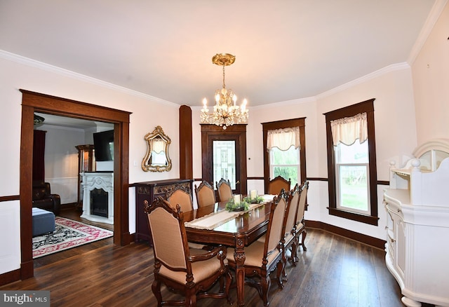 dining area featuring dark hardwood / wood-style flooring, crown molding, and a chandelier