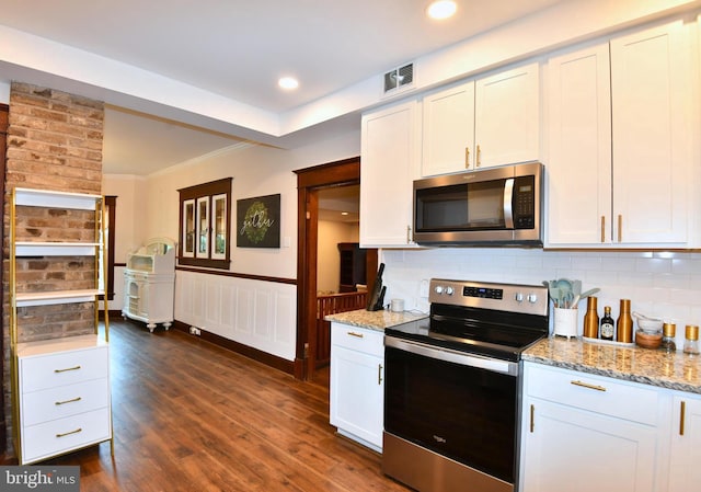 115 S Summit Ave, Woodstock, VA 22664 - kitchen with appliances with stainless steel finishes, dark wood-type flooring, light stone counters, tasteful backsplash, and white cabinets