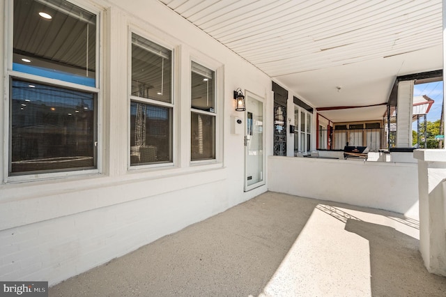 view of patio / terrace featuring a porch and a grill