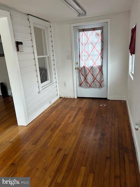 interior space with dark hardwood / wood-style flooring