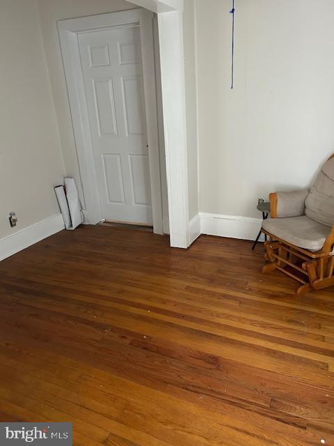 unfurnished room featuring wood-type flooring