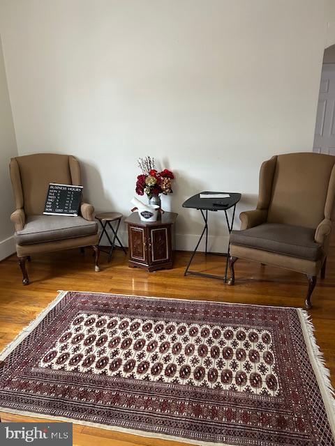 sitting room featuring hardwood / wood-style flooring