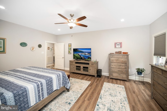 bedroom featuring ceiling fan and hardwood / wood-style flooring