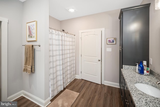 bathroom with vanity and hardwood / wood-style flooring