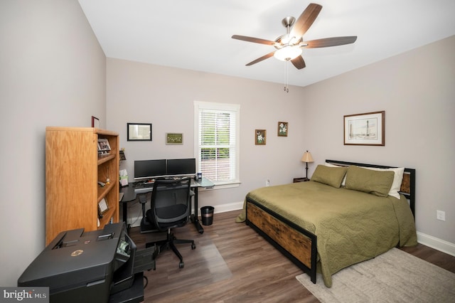 bedroom with ceiling fan and dark wood-type flooring