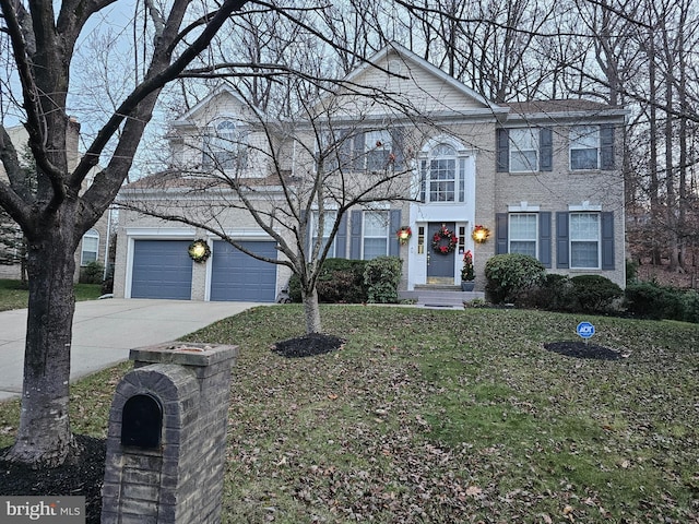 12817 Glasgow Ct, Fort Washington, MD 20744 - view of front of property featuring driveway, a front yard, and brick siding