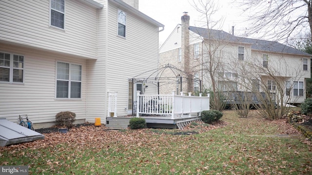 12817 Glasgow Ct, Fort Washington, MD 20744 - back of house featuring a deck and a chimney