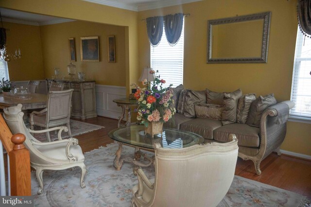 12817 Glasgow Ct, Fort Washington, MD 20744 - living room featuring wood finished floors, ornamental molding, wainscoting, and a decorative wall