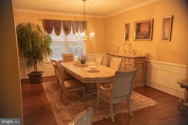12817 Glasgow Ct, Fort Washington, MD 20744 - dining space featuring a chandelier, crown molding, dark wood-style flooring, a decorative wall, and wainscoting