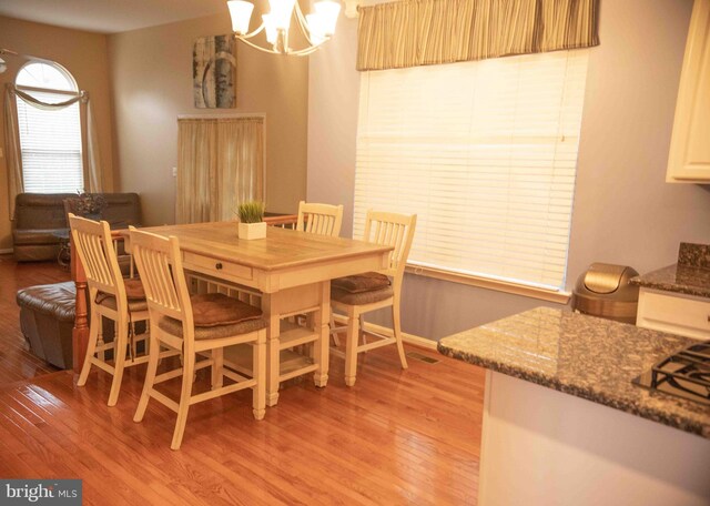 12817 Glasgow Ct, Fort Washington, MD 20744 - dining room featuring light wood-type flooring and a chandelier