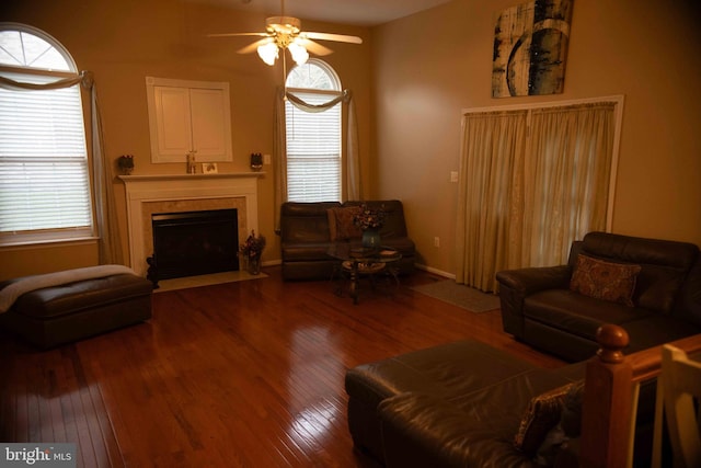 12817 Glasgow Ct, Fort Washington, MD 20744 - living area with a ceiling fan, wood finished floors, a fireplace with flush hearth, and plenty of natural light