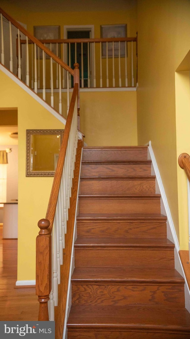 12817 Glasgow Ct, Fort Washington, MD 20744 - staircase featuring wood finished floors and baseboards