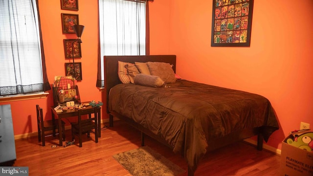 12817 Glasgow Ct, Fort Washington, MD 20744 - bedroom featuring multiple windows and wood finished floors