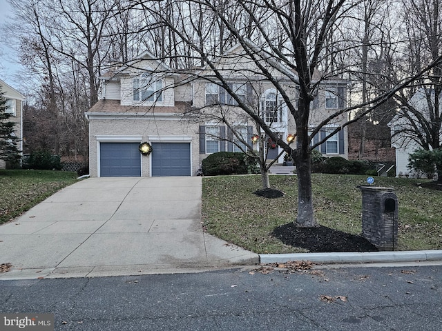12817 Glasgow Ct, Fort Washington, MD 20744 - traditional-style house featuring driveway, a front lawn, and a garage
