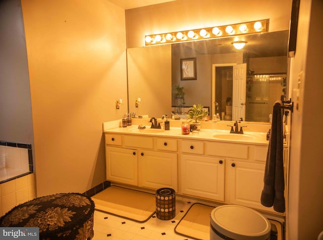 12817 Glasgow Ct, Fort Washington, MD 20744 - bathroom with double vanity, an enclosed shower, a bath, and tile patterned floors
