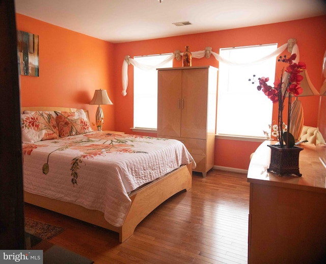 12817 Glasgow Ct, Fort Washington, MD 20744 - bedroom featuring multiple windows and hardwood / wood-style flooring