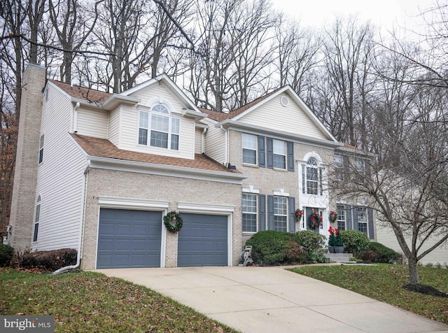12817 Glasgow Ct, Fort Washington, MD 20744 - view of front of house featuring concrete driveway, a chimney, a garage, brick siding, and a shingled roof