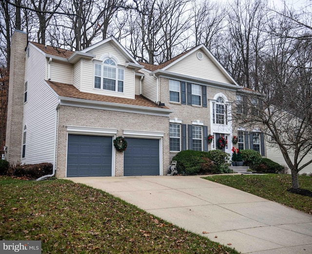 12817 Glasgow Ct, Fort Washington, MD 20744 - traditional home with driveway, a chimney, a garage, and brick siding