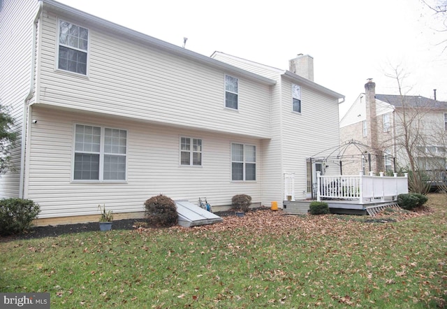12817 Glasgow Ct, Fort Washington, MD 20744 - back of property with a gazebo, a wooden deck, a yard, and a chimney