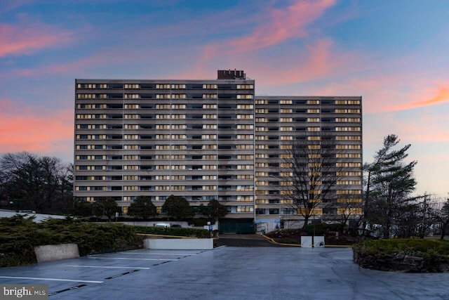 view of outdoor building at dusk