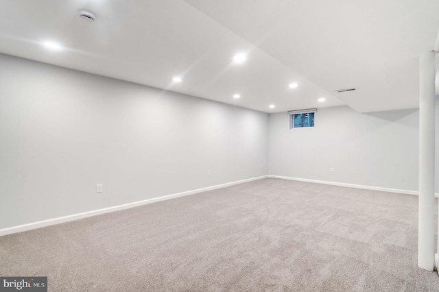 basement with light colored carpet