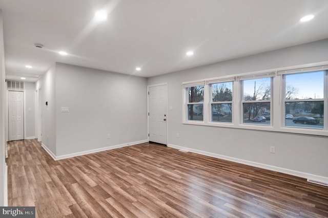 empty room featuring wood-type flooring